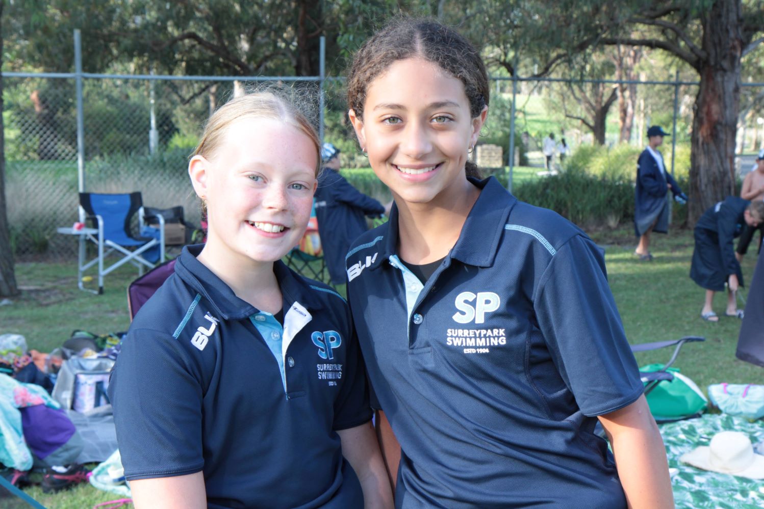 Two girls in Surrey Park uniform, smiling