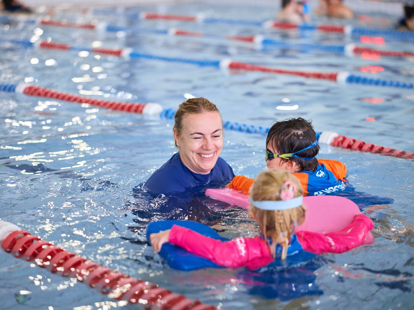 Swimming teacher smiling while teaching lessons