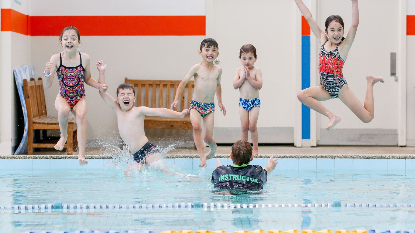 5 kids jumping in the pool at heidelberg